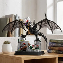 Lego moc dragon maléfique noir et argent aux yeux rouges perché sur une maquette détaillée de château game of thrones