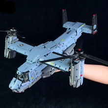 Modèle lego moc hélicoptère militaire gris v-22 osprey avec pales noires et feux rouges à l’arrière