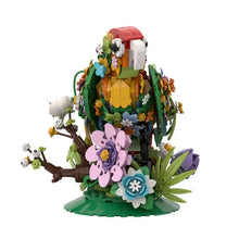 Lego moc oiseaux animaux volants modèle de perroquet coloré en lego avec fleurs et feuillage multicolores