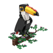 Lego moc oiseaux animaux volants avec toucan en lego detalie noir blanc jaune rouge sur branche fleurie verte