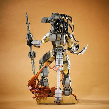 Lego moc predator alien figure in metallic gray and yellow armor holding a weapon and blade, detailed moc predator