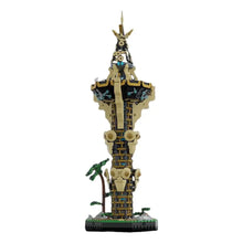 Détail lego moc zelda tour sheikah d un totem haut avec sections beige noir et accents bleus orné de visages stylisés