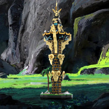 Tour Sheikah lego moc zelda en lego doré et noir avec design stylisé et motifs circulaires pointus