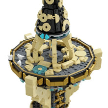 Détail lego moc zelda tour sheikah d’une tour futuriste multi-niveaux en briques noires et beiges avec pièces translucides bleues