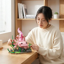 Lego mog animal axolotl en lego rose avec décor aquatique vert et gris disponible dans magasins de jouets pour carnaval