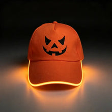 Casquette lumineuse orange pour fêtes avec visage citrouille noir et clignotement lent alimentée par piles cr2032