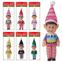 Lutin de noël décoratif à tenue rayée avec chapeau rayé rose et blanc et pompon blanc moelleux
