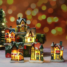 Maisonnette lumineuse de noël miniature à piles avec toits enneigés et fenêtres lumineuses en résine peinte