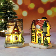 Deux maisonnettes lumineuses de noël miniature à piles avec toits marron et rouge et décorations festives lumineuses