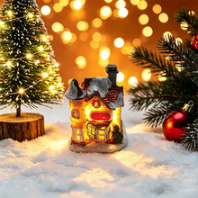 Maisonnette lumineuse de noël miniature à piles avec toit enneigé, enseigne rouge toy shop et fenêtres lumineuses