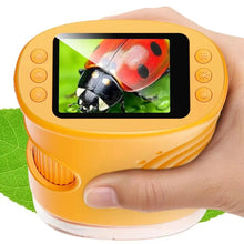 Microscope numérique portable orange avec écran circulaire de 2 pouces affichant une coccinelle rouge en gros plan