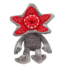 Peluche monstre fleur halloween grise avec tête rouge en forme d étoile et dents pointues en couture blanche