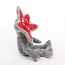 Peluche monstre fleur halloween grise avec bouche rouge en forme detoile et dents triangulaires blanches