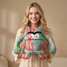 Peluche monstre multicolore en tissu peluche avec design éclaboussures arc-en-ciel et yeux noirs brodés pour halloween
