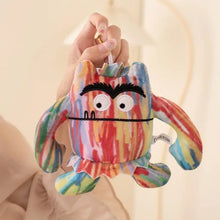 Peluche monstre multicolore à grande bouche en tissu rayé arc-en-ciel avec visage brodé pour halloween