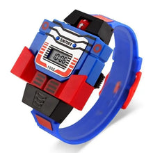 Montre transformers optimus prime digitale bleu et rouge avec accents noirs et visage de personnage sur le dessus en boîte cadeau