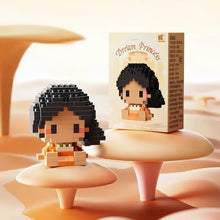 Une figurine princesse pixelisée en nanoblock personnages disney noire et orange en blocs plastiques avec emballage