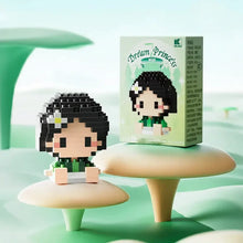 Figurine nanoblock personnages disney d une fille aux cheveux noirs et joues roses en tenue verte en briques plastiques