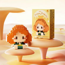 Figurine orange de princesse rêve en nanoblock personnages disney en plastique avec visage blanc et tenue verte et jaune
