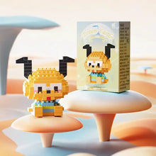 Figurine nanoblock personnages disney chien jaune pixelisé en briques plastique avec oreilles noires et tenue rayée colorée