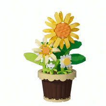 Nanoblock mini fleur avec pot en lego vibrant composé de tournesol jaune, marguerites blanches et feuilles vertes dans un magasin de jouets