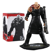 Figurine nemesis t-type en pvc noir de 11,5 cm sur socle assorti avec emballage rouge et blanc en arrière-plan