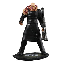 Figurine nemesis t-type en pvc de 11.5 cm représentant un homme chauve musclé noir avec tatouages et armes rouges