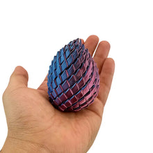 Fidget œuf de dragon anti-stress en céramique iridescente bleu teal et violet format compact idéal magasins de jouets