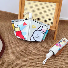 Parapluie automatique crayon shin-chan blanc avec motifs multicolores et design lapin sur fond clair