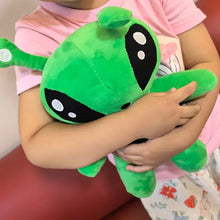 Peluche alien vert 30cm douce et lumineuse avec taches noires aux yeux et détails blancs circulaires