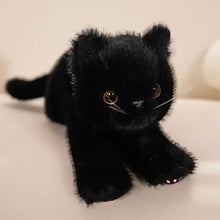 Peluche chaton mignon doudou noir avec fourrure douce, yeux dorés et coussinets roses en peluche