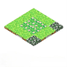 Plaque base magnétique style minecraft avec herbe verte pixelisée, fleurs roses et pierres grises en rendu isométrique