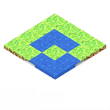 Plaque base magnétique bloc minecraft avec fontaine en forme de diamant pixelisée et bassins bleus entourés de blocs dherbe