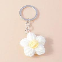 Porte-clés fleur tricotée délicate blanche avec centre jaune et anneau métallique argenté pour clés