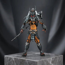 Figurine predator clan leader en armure noire et orange ornée avec yeux rouges lumineux, figurine daction détaillée