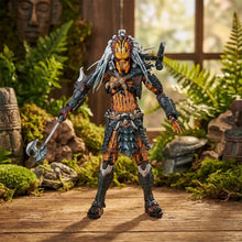 Figurine predator clan leader avec armure orange et noire, marquages tribaux argentés, tête détaillée et hache