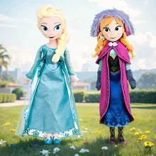 Peluches princesses elsa en robe teal scintillante et anna en cape magenta pour déguisement carnaval conte hivernal