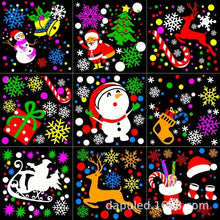 Projecteur de noël à 16 motifs lumineux avec décorations de noël en décalcomanies colorées sur fond noir