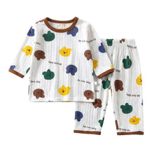 Pyjama enfant motifs animaux blanc à manches longues avec imprimés colorés dours et bordure marron