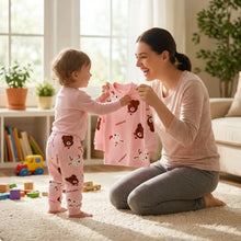 Pyjama enfant à manches longues rose avec motifs dours et lapins blancs pour un confort optimal