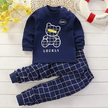 Pyjama enfant ourson bleu marine manches longues avec motif grille blanche et ourson bleu marine avec bulle hello