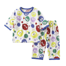 Pyjama enfant petits monstres en coton blanc avec t-shirt et short imprimé monstres colorés et liseré bleu