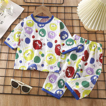 Pyjama enfant petits monstres avec t-shirt et short blanc à motifs colorés ronds et liseré bleu