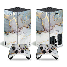 Skin xbox series x motifs colorés en marbré or et gris avec finition brillante et manettes assorties