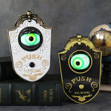 Deux sonnettes décoratives halloween ornées dœil lumineux vert et accents dorés style vintage
