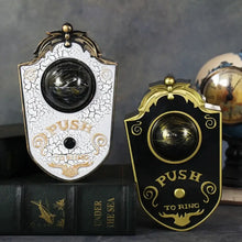 Deux sonnette décorative halloween œil lumineux vintage en blanc craquelé et noir brillant avec bouton poussoir doré
