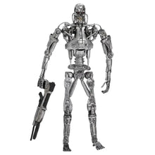 Figurine squelette terminator t-800 endoskeleton argentée articulée avec fusil noir inspirée de judgment day