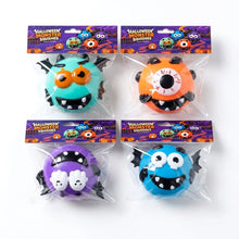 Squishy chien à visage interchangeable en couleurs teal orange violet et bleu avec yeux cartoon dents et ailes de chauve-souris