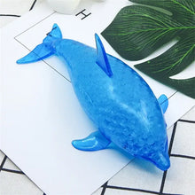 Squishy dauphin bleu translucide avec surface texturée et billes gélifiées pour usage requin anti-stress