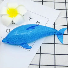 Squishy dauphin requin anti-stress bleu translucide avec surface texturée et billes gélifiées pour détente